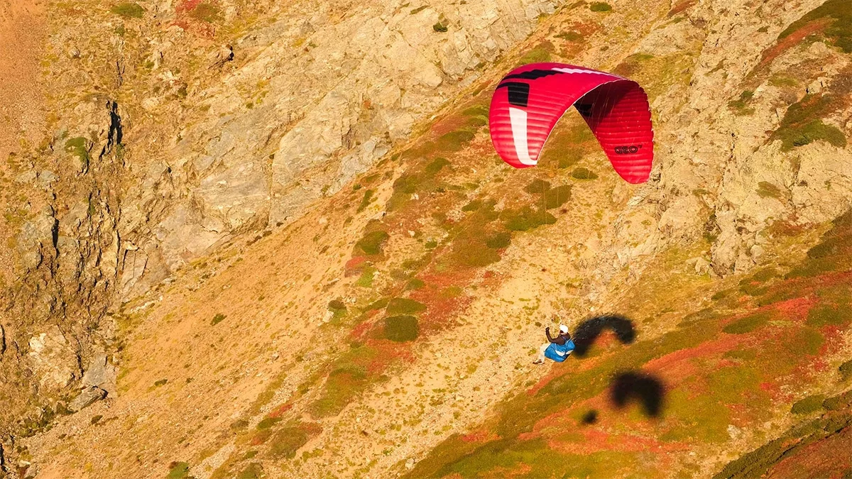 ozone-geo-7-red-glider-against-mountain-with-shadow ozone-geo-7-red-glider-against-mountain-with-shadow