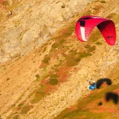 ozone-geo-7-red-glider-against-mountain-with-shadow